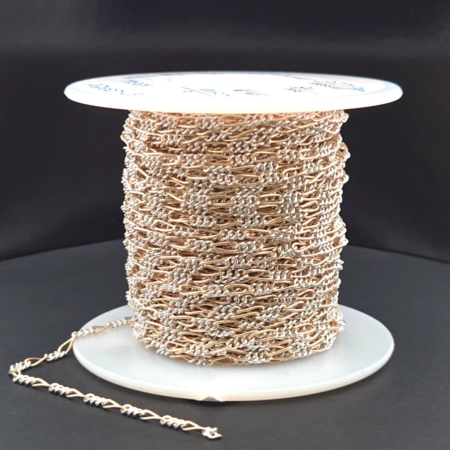XM/2531CTT. 14k Gold Filled and Sterling Silver 1 Long and 3 Short Link Chain: 1 Ft. / 6.1mm-7mm / Figaro