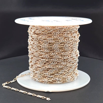 XM/2531CTT. 14k Gold Filled and Sterling Silver 1 Long and 3 Short Link Chain: 1 Ft. / 6.1mm-7mm / Figaro