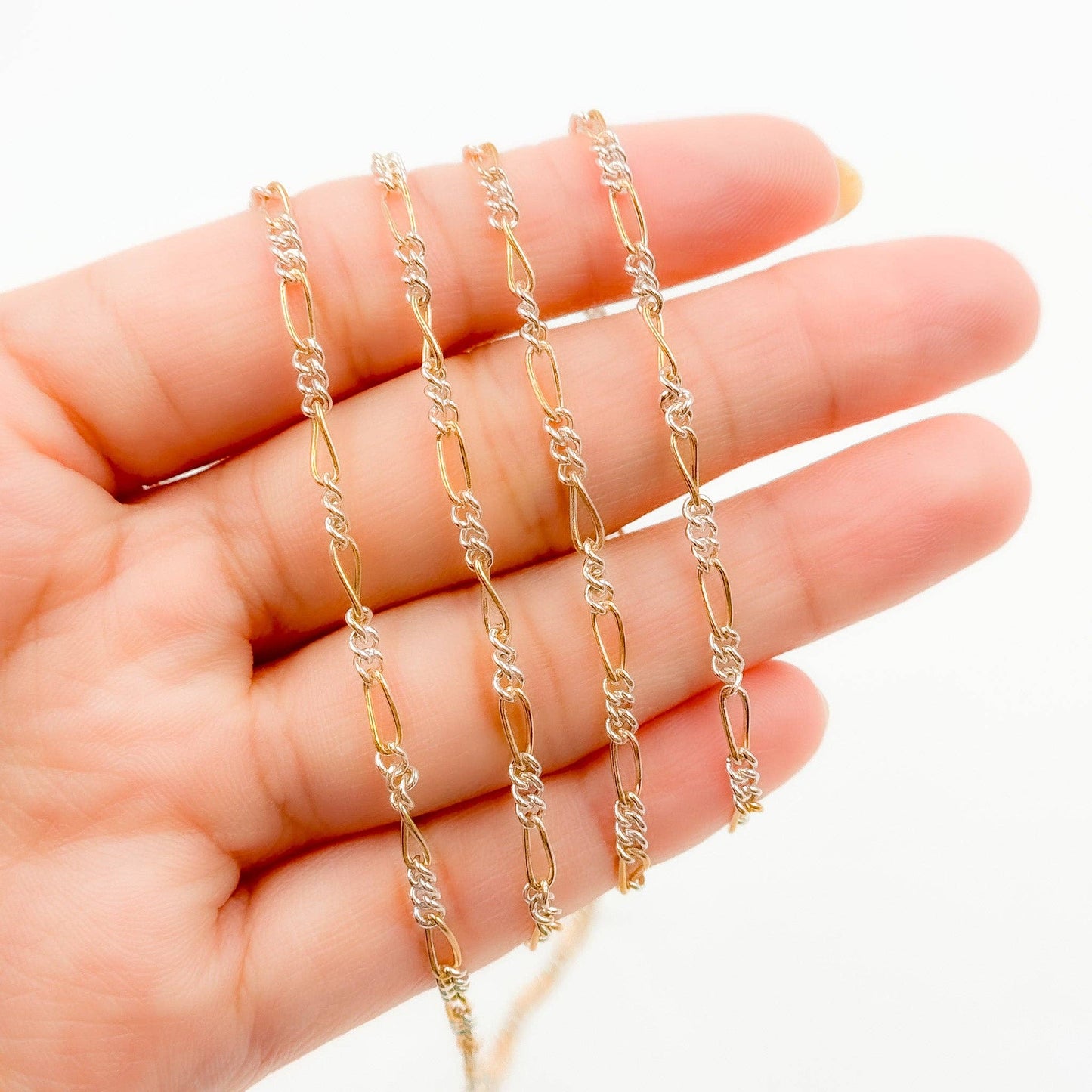 XM/2531CTT. 14k Gold Filled and Sterling Silver 1 Long and 3 Short Link Chain: 1 Ft. / 6.1mm-7mm / Figaro
