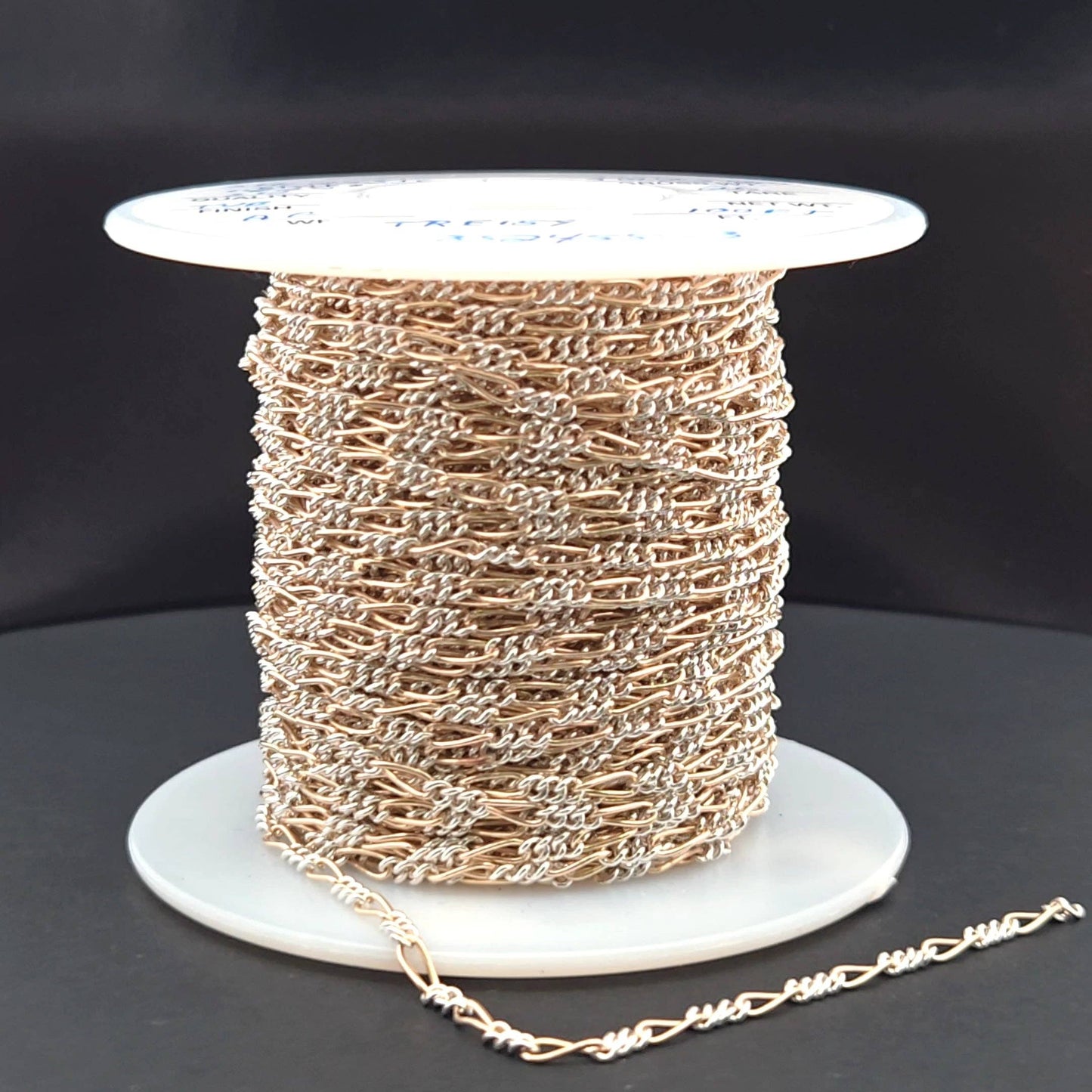 XM/2531CTT. 14k Gold Filled and Sterling Silver 1 Long and 3 Short Link Chain: 1 Ft. / 6.1mm-7mm / Figaro
